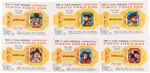 NABISCO "SHREDDIES" 1960s PLASTIC PIRATE RING PREMIUM SET WITH UNCUT SHEET & ORIGINAL ART. | Hake’s