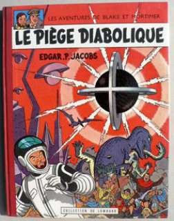 Jacobs. | Â« Le Piège Diabolique Â». Lombard 1962. Cartonné dos toilé rouge. | Tessier Sarrou