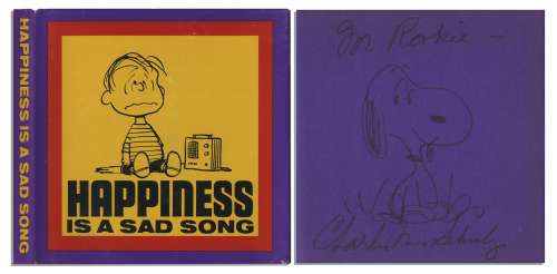 Charles Schulz Hand-Drawn Sketch of Snoopy, Within His Signed ’’Peanuts’’ Book, ’’Happiness is a Sad Song’’ | Nate Sanders