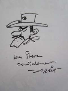 Morris | Morris - Lucky Luke - Marcel Dalton - Met opdrachttekening - Broché - EO - (1999) | Catawiki