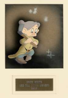 "SNOW WHITE AND THE SEVEN DWARFS" FRAMED DOPEY COURVOISIER PRODUCTION CEL SETUP. | Hake’s